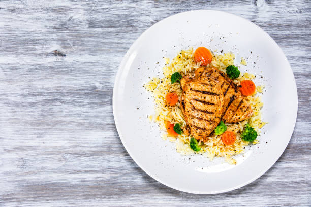 istock Roast chicken filets with rice and vegetables 1168953515