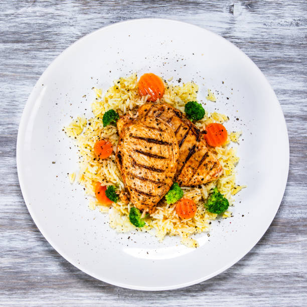 istock Roast chicken filets with rice and vegetables 1168953542
