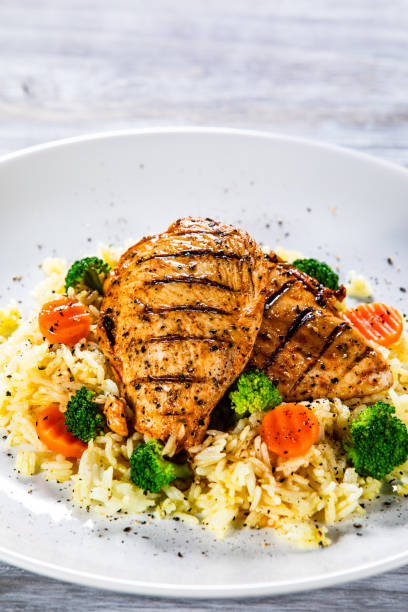 istock Roast chicken filets with rice and vegetables 1168953599