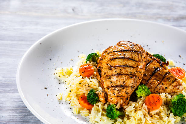 istock Roast chicken filets with rice and vegetables 1168953642