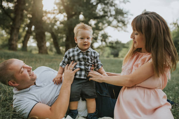 istock Young happy family in the park 1168953663