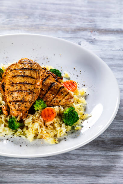 istock Roast chicken filets with rice and vegetables 1168953692