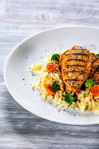 istock Roast chicken filets with rice and vegetables 1168953746