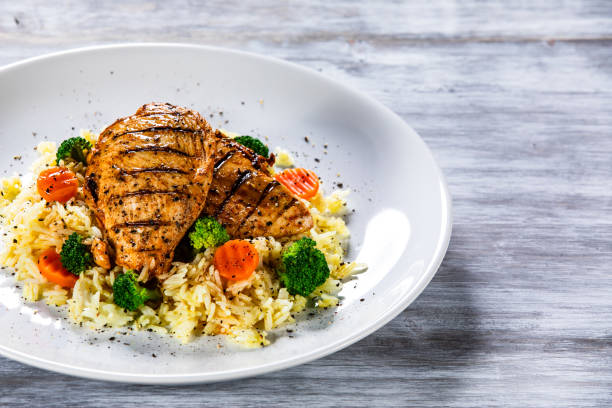 istock Roast chicken filets with rice and vegetables 1168953799