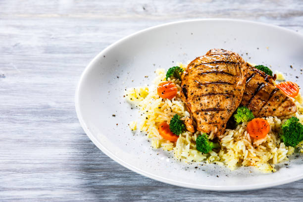 istock Roast chicken filets with rice and vegetables 1168953821