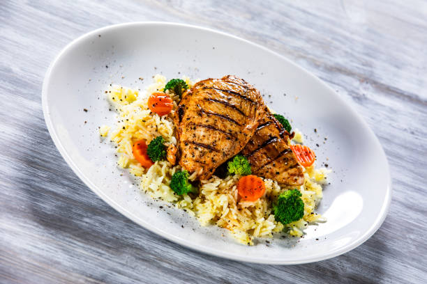 istock Roast chicken filets with rice and vegetables 1168953916
