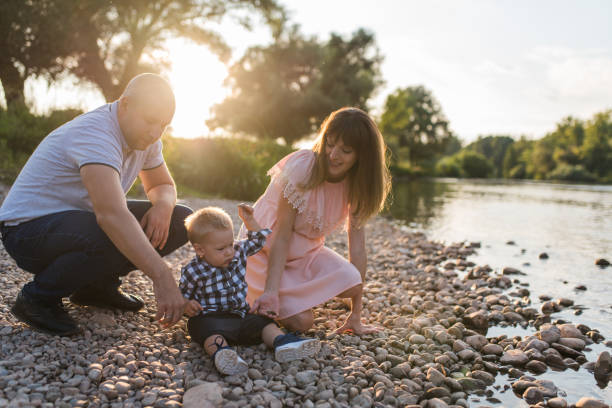 istock Young happy family in the park 1168957751