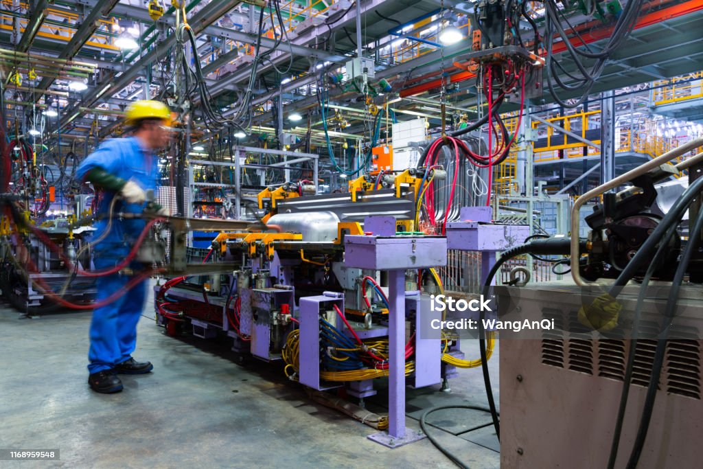 Modern automatic automobile manufacturing workshop. A busy car production line. Industrial scenery background. Manufacturing Stock Photo