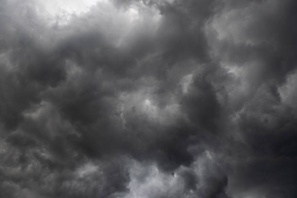 istock Weather in summer with black cloud and storm, Dark sky and dramatic storm clouds 1168962670