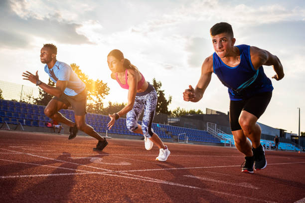 Sprint competition on running track. Finish line low angle view.