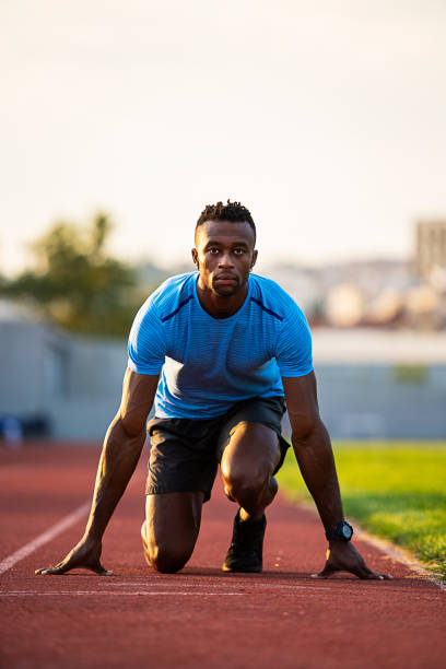 istock Athlete Man Preparing And Runs Hurdles for Track and Field 1168965428