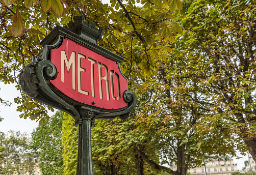 Entrance sign to the Metro, beautiful art nouveau style in Paris France.