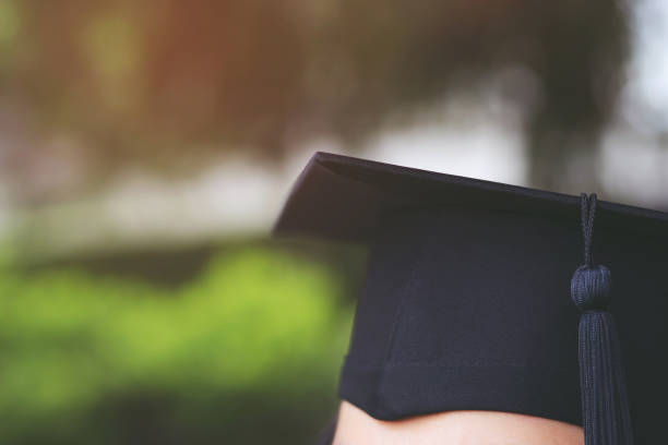 istock backside graduation hats during commencement success graduates of the university, Concept education congratulation. Graduation Ceremony ,Congratulated the graduates in University during commencement. 1168968079