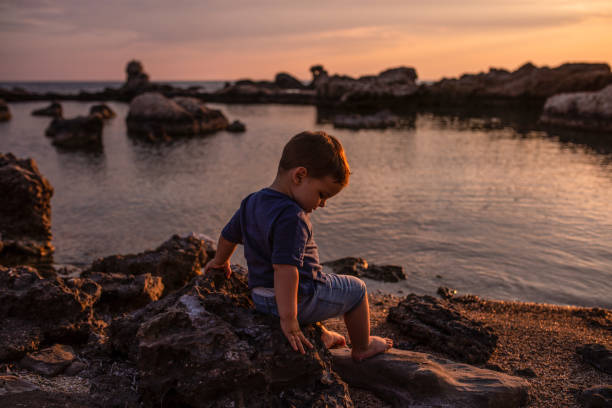 istock Toddler playing at the beach 1168969225