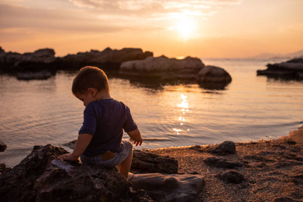 istock Toddler playing at the beach 1168969331