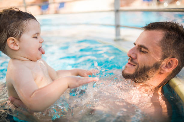 istock Family at the pool 1168969398