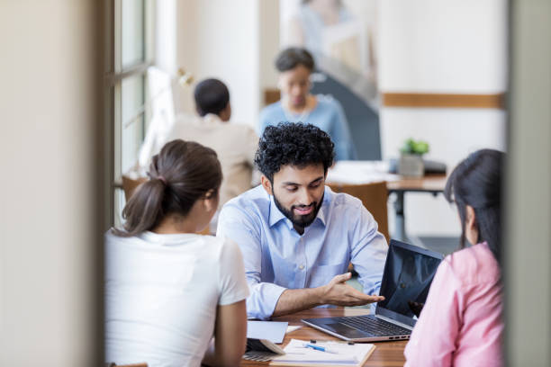 istock Loan officer meets with college student about a student loan 1168969640