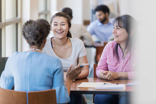 istock Loan officer discusses student loan with college student 1168969654