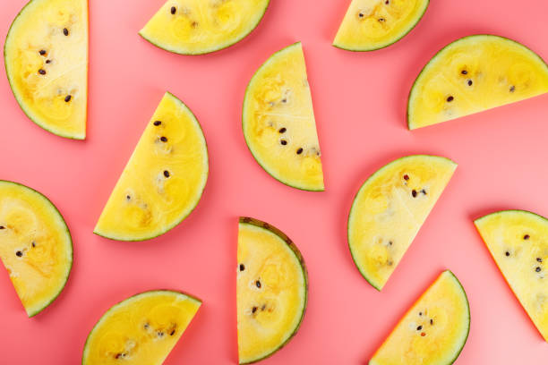 istock Slice of Yellow watermelon on a pink background. Bright summer background 1168974854