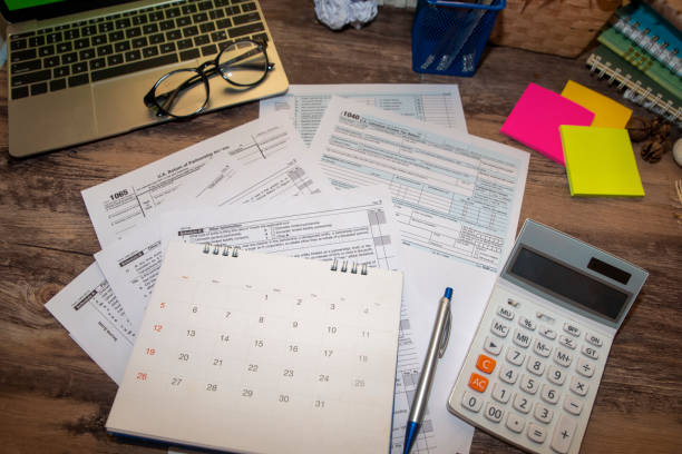 Individual Income Tax Planning Budget Concept.Calendar 2019 and Individual Income Tax Form For who have income According to United States law.This is the season that has to pay taxes,deadline of tax payment. irs office stock pictures, royalty-free photos & images