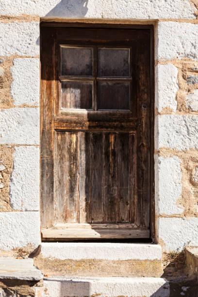 istock Old wooden door with window 1168978187