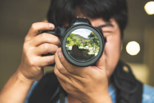 Photographing Camera - Photographic Equipment, Hand, Digital Single-Lens Reflex Camera, Human Hand, Shoot camera covers pictures stock pictures, royalty-free photos & images