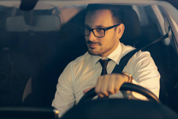 istock Businessman driving a car 1168978326