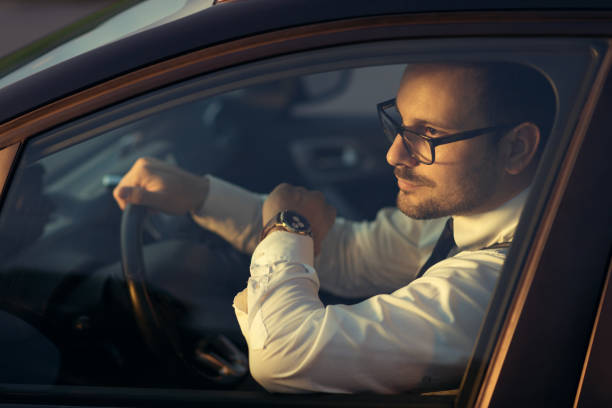 istock Businessman driving a car 1168978349