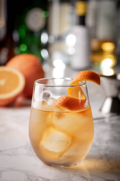 cocktail, old fashioned with orange peel cocktail, old fashioned with orange peel glass of bourbon stock pictures, royalty-free photos & images