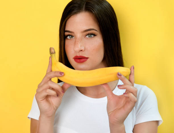 istock Woman with banana 1168981256