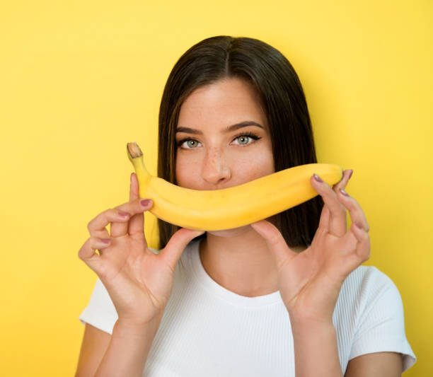 istock Woman with banana 1168981258