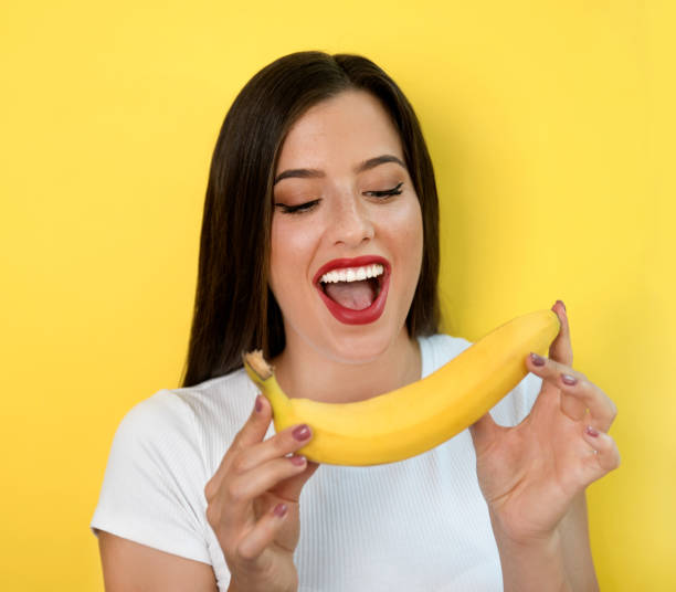 istock Woman with banana 1168981267