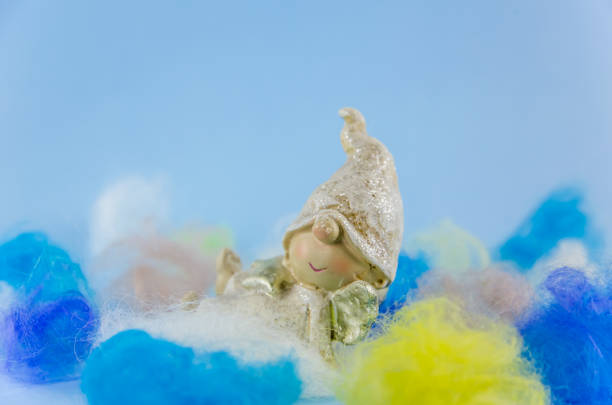 istock angels in magical multicolored clouds. New Year, Christmas. 1168981584
