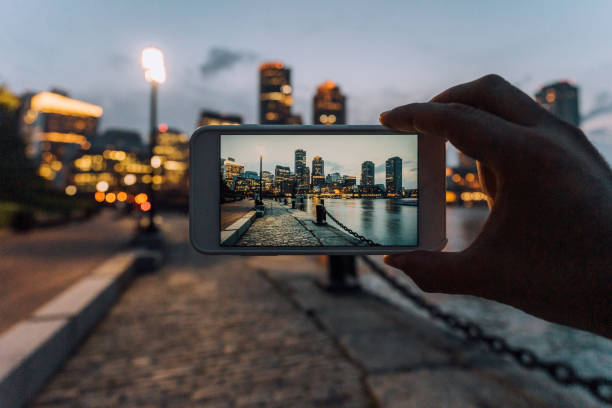 istock Photographing Boston skyline at sunset with smartphone 1168983621