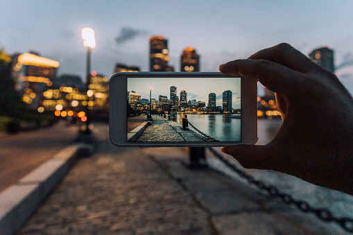 Photographing Boston skyline at sunset with smartphone