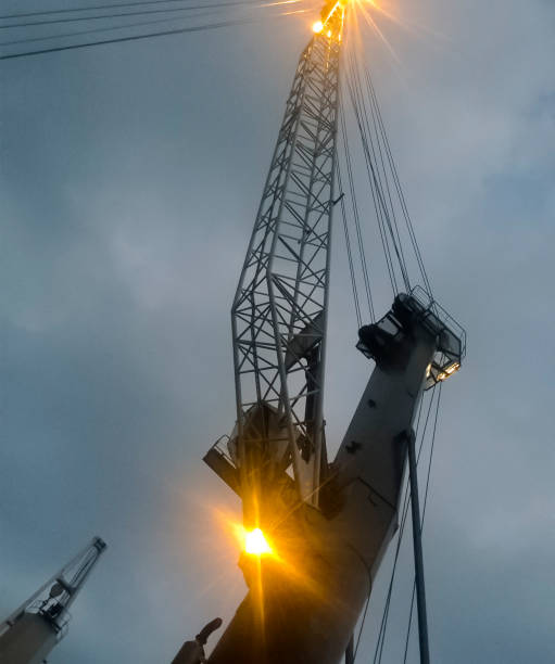 port cranes against the sky. cargo industrial port - coal crane transportation cargo container imagens e fotografias de stock