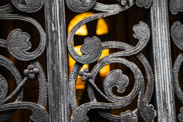 istock Cross seen through a metal gate 1168987463