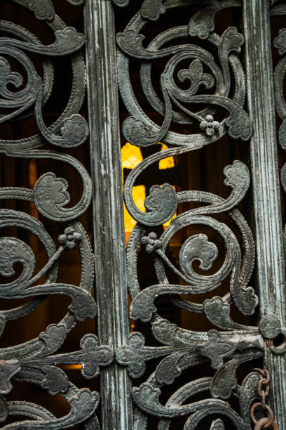 istock Cross seen through a metal gate 1168987520