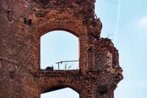 istock Ruins from an old brick building against the sky. Empty windows 1168988694