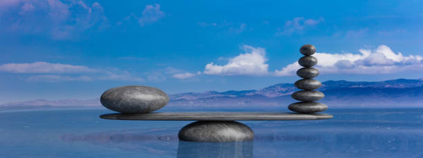 istock Zen stones row from large to small  in water with blue sky. 3d illustration 1168988921