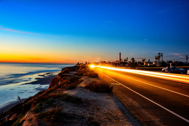 Pacific Coast Highway in Carlsbad Coast Highway 101, also called Carlsbad Blvd in this stretch of highway along the coast of Carlsbad, Calfornia just north of San Diego shot at dusk. pacific coast stock pictures, royalty-free photos & images