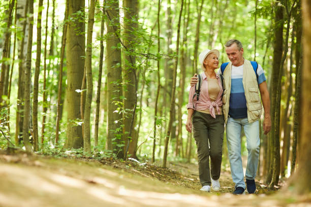 istock Senior couple walking in nature 1168989943