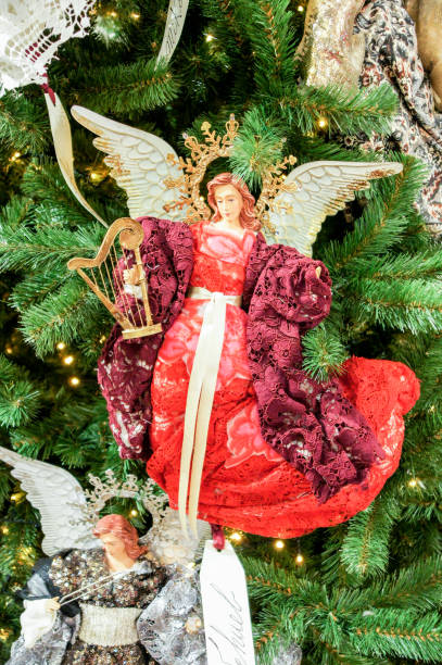 istock Christmas toy angel on spruce branches. 1168990547