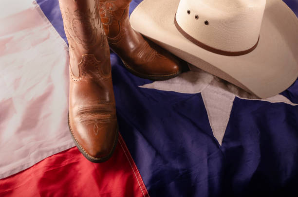 istock Texas flag wrapping cowboy hat and boots 1168990745