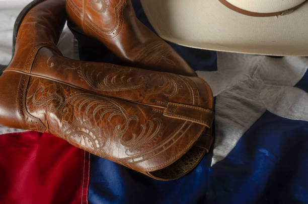 istock Texas flag wrapping cowboy hat and boots 1168990881