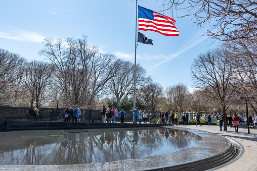 Tourists are visiting the Korean War Veterans Memorial.
The Korean War Veterans Memorial that commemorates those who served in the Korean War. Located in West Potomac Park, southeast of the Lincoln Memorial. Washington DC, USA.