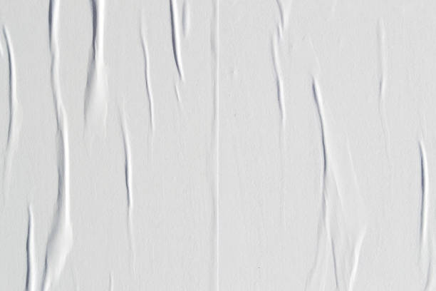 istock White creased poster texture. Abstract background. 1168991631