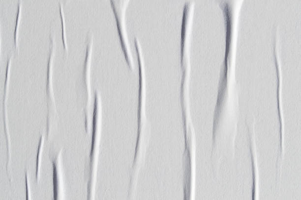 istock White creased poster texture. Abstract background. 1168991634