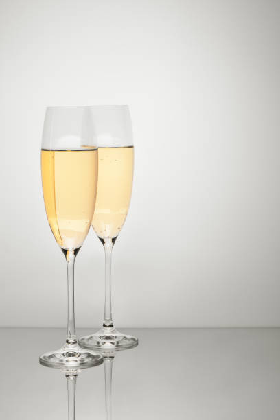 istock Two glasses of champagne isolated on white background 1168992145