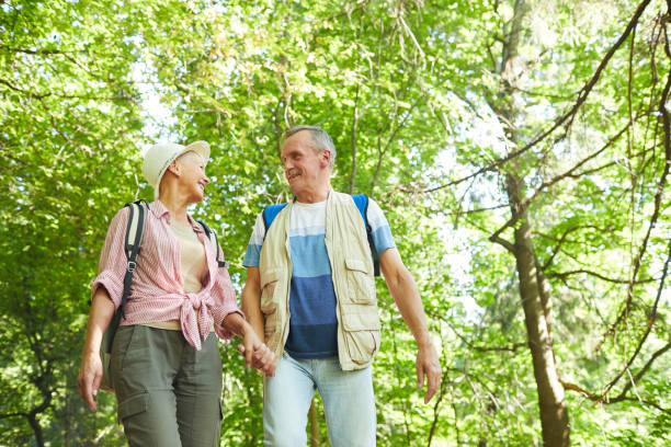 istock Couple hiking together in nature 1168993526